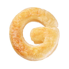 Letter G made with cookie or biscuit isolated on white