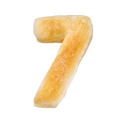 Digit 7 made with cookie or biscuit isolated on white