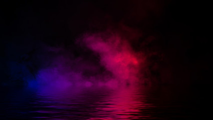 Abstract multi color fog smoke effects on isolated black background with rerflection in water . Creative texture. Design element.