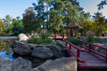 Traditional Japanese gardens with a lake, bridges and stones