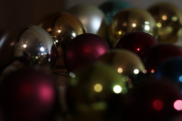 colorful christmas balls on red background