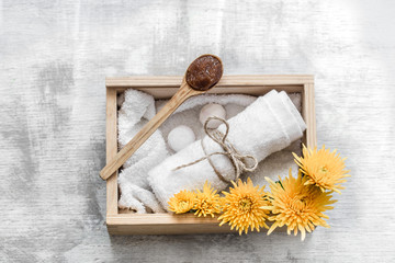 Spa skin care items in wooden box .
