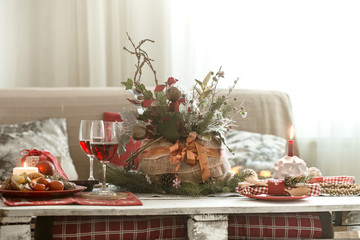 Beautifully decorated Christmas table in the living room.