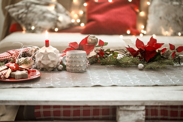 Beautifully decorated Christmas table in the living room.