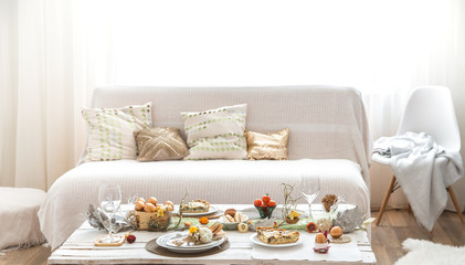 The interior of the room with a festive Easter table .