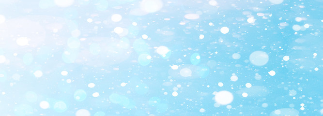 snowflakes isolated on blue sky - winter snow background panorama banner long