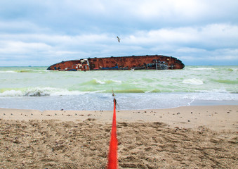 moored tanker wreck, ecology problem on the beach