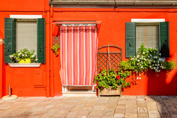 Fototapeta na wymiar Orange house on Burano island near Venice, Italy