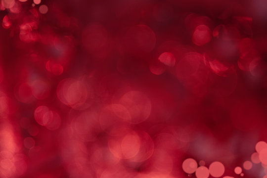 Festive red background bokeh of glare