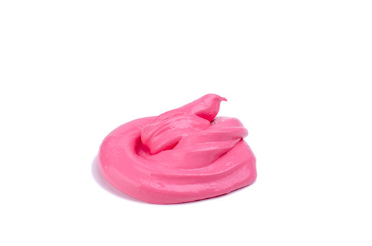 Cool handmade toy slime twisted in a poop form laying on a table. World wide trendy toy isolated on a white background.