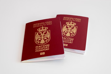 Two Serbian passports on white background, selective focus, concept