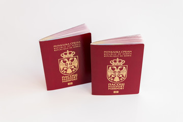 Two Serbian passports on white background, selective focus, concept