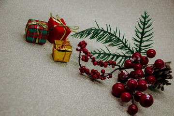 The christmas toys. The gold background. Gifts and balls