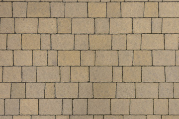 Yellow stone pavement seamless texture. Abstract background of pavement close-up. Seamless texture. Perfect tiled on all sides 