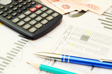 Business concept with a report and a calculator