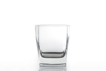 Empty glass for water or alcohol isolated on a white background. Close-up photo