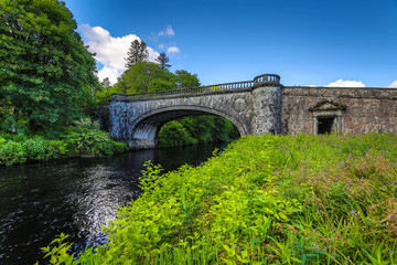 Fototapeta na wymiar Old bridge and picturesque Scotland morning landscape.