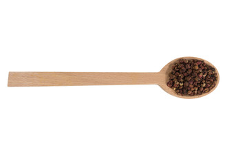 sichuan pepper in wooden spoon isolated on white background. spices and food ingredients. spices and food ingredients