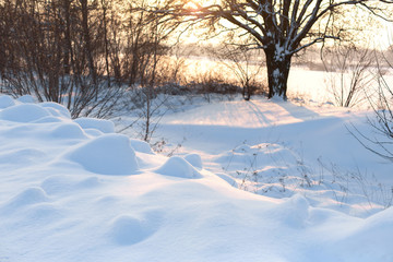 Winter poorly cleared road. Road in the countryside strewn with snow. Winter landscape with snowdrifts