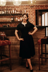 Fashion girl wanna drink some cocktail in the bar alone. sad retro woman in the club alone.