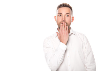 shocked businessman covering mouth with hand isolated on white