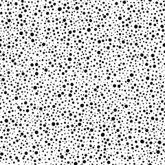 Black and white seamless polka dot pattern. Random ink circles and splashes. Cute simple doodle style pattern. Small, tiny specks. Background for textile. Vector illustration.