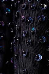 Fabric with sequins and sequins of bright colors. Fashion glitter fabric, sequins. Shiny surface