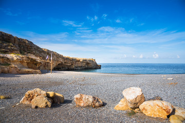 Beach of Spilies or Kitrenosi with sea caves near Rethimno, Crete, Greece.