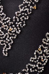 Fabric with sequins and sequins of bright colors. Fashion glitter fabric, sequins. Shiny surface