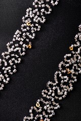 Fabric with sequins and sequins of bright colors. Fashion glitter fabric, sequins. Shiny surface