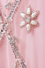 Fabric with sequins and sequins of bright colors. Fashion glitter fabric, sequins. Shiny surface