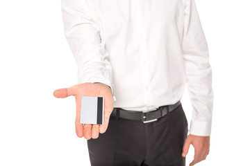 cropped view of businessman holding credit card isolated on white