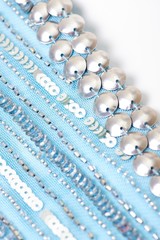 Fabric with sequins and sequins of bright colors. Fashion glitter fabric, sequins. Shiny surface