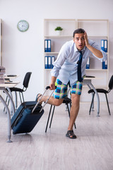 Fototapeta na wymiar Young employee escaping for summer vacation
