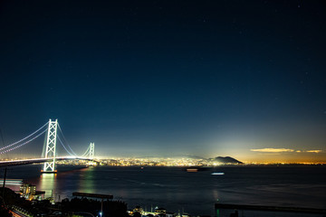 Fototapeta na wymiar Night view of the strait and Kobe city seen from Awaji Island, Hyogo Prefecture
