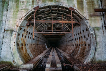 Entrance to large round underground tunnel