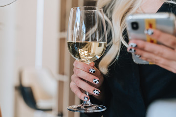 Woman hand with glasses of champagne
