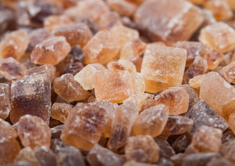 Close-Up shot of natural caramelized sugar cubes on white background.