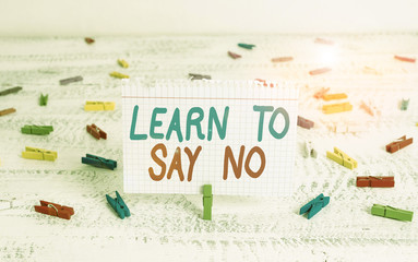 Handwriting text writing Learn To Say No. Conceptual photo dont hesitate tell that you dont or want doing something Green clothespin white wood background colored paper reminder office supply