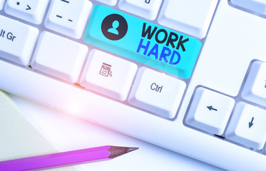 Writing note showing Work Hard. Business concept for Laboring that puts effort into doing and...