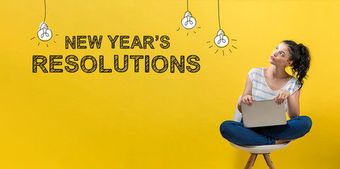 New Year's Resolutions with young woman using a laptop computer