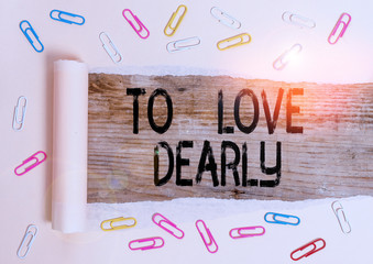 Conceptual hand writing showing To Love Dearly. Concept meaning Love someone very much in the more...
