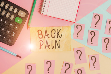 Writing note showing Back Pain. Business concept for Soreness of the bones felt at the lower back portion of the body Mathematics stuff and writing equipment above pastel colours background