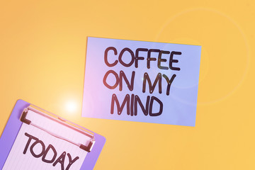 Text sign showing Coffee On My Mind. Business photo text Addiction to Coffee Starbucks Thinking of breaktime Metal clipboard holding blank paper sheet square page colored background