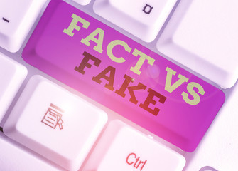 Handwriting text Fact Vs Fake. Conceptual photo Rivalry or products or information originaly made...