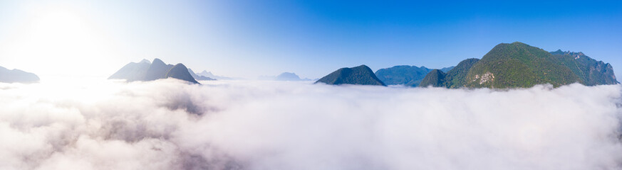 Aerial panoramic Nam Ou River drone flying over morning fog mist and clouds, Nong Khiaw Muang Ngoi...