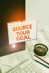 Fototapeta premium Writing note showing Source Your Goal. Business concept for work on your dreams and determine how to do that Set list Note paper taped to black computer screen near keyboard and stationary