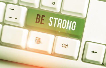 Writing note showing Be Strong. Business concept for able to withstand great circumstances or...