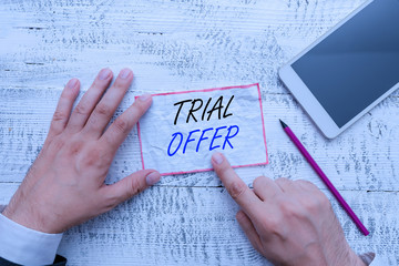 Writing note showing Trial Offer. Business concept for A temporary free or discounted offer of a...