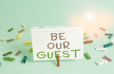 Word writing text Be Our Guest. Business photo showcasing You are welcome to stay with us Invitation Hospitality Colored clothespin rectangle square shaped paper light blue background